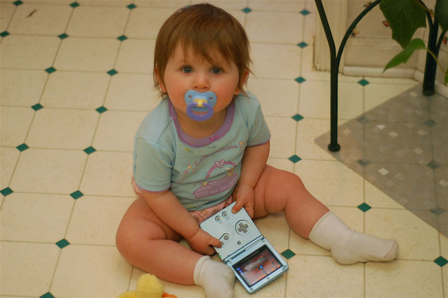 Future girl geek
Abigail plays with James' gameboy
Keywords: Abigail