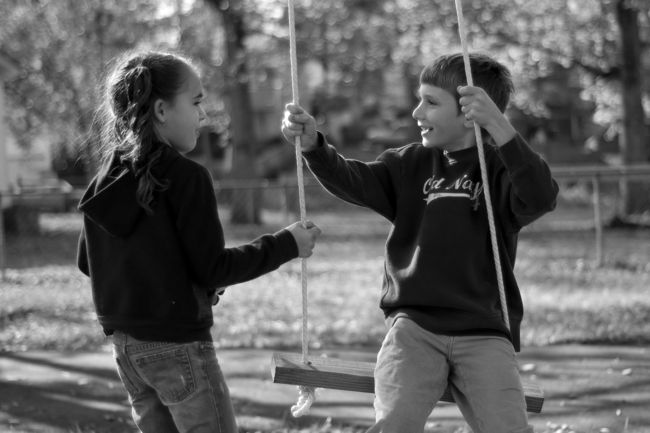 James and the neighbor girl
on the swing
