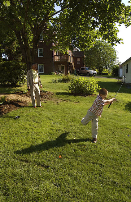 Hitting golfballs in the backyard
James and Dad
Keywords: James Dad